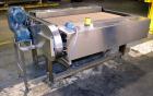 Used Nercon Accumulation Conveyor/Table, Stainless Steel. Approximate 60” wide x 48” long plastic belt with automatic push bar. Driven by a 1/2hp Reeves variable speed gear motor. Stainless steel fra...