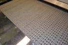 Used Nercon Accumulation Conveyor/Table, Stainless Steel. Approximate 60” wide x 48” long plastic belt with automatic push bar. Driven by a 1/2hp Reeves variable speed gear motor. Stainless steel fra...