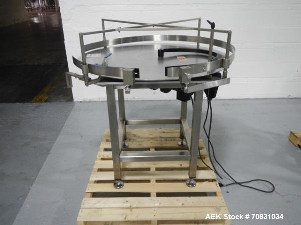 Used Accumulation Table, 42" Diameter, Stainless Steel. On stand with motor drive.