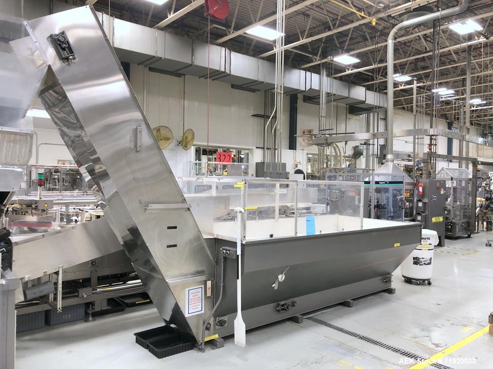 Used Bulk bottle live bottom hopper with integrated stainless steel elevator.