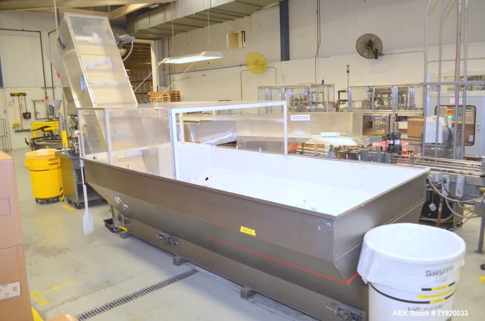 Used Bulk bottle live bottom hopper with integrated stainless steel elevator.