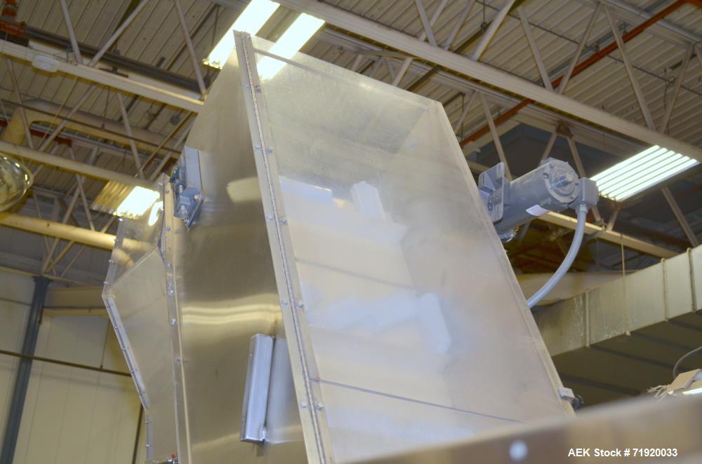 Used Bulk bottle live bottom hopper with integrated stainless steel elevator.
