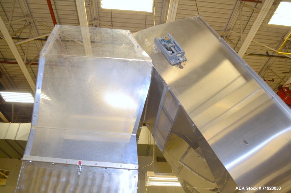 Used Bulk bottle live bottom hopper with integrated stainless steel elevator.