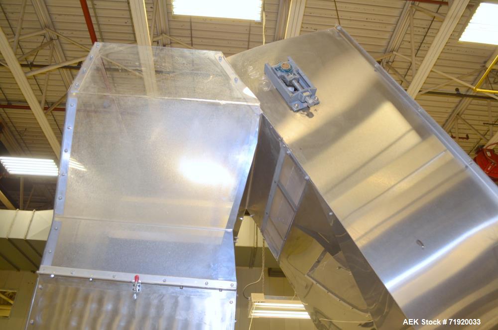 Used- Bulk bottle live bottom hopper with integrated stainless steel elevator.