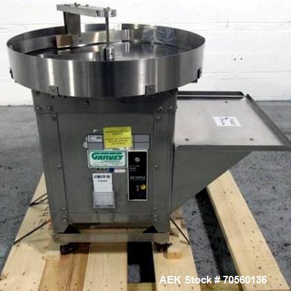 Used Garvey 30" diameter accumulation table, model 1546, stainless steel construction, 1/4 hp motor with speed control, 115 volt, with 24" x 17" table mounted on side, serial #9533.