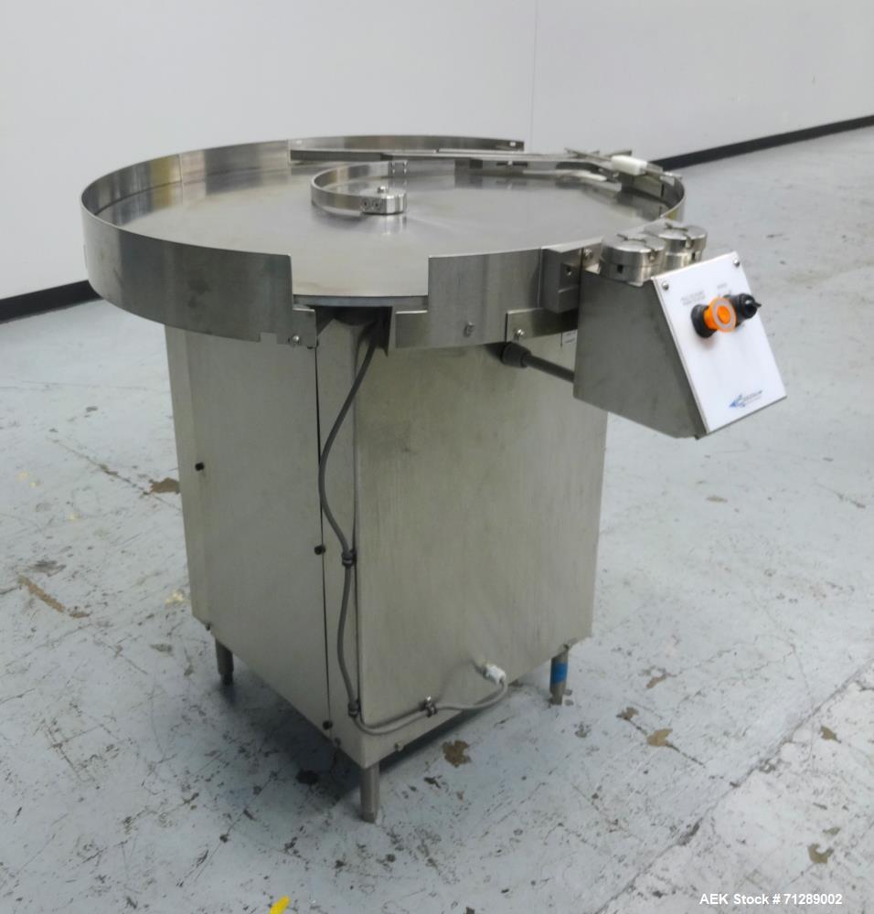 Used Cozzoli Machine Company Rotary Unscrambling/Accumulation Table, Model UT-AT36. 36" Diameter. Has adjustable speed control. Stainless steel construction. Mounted on  (4) legs.