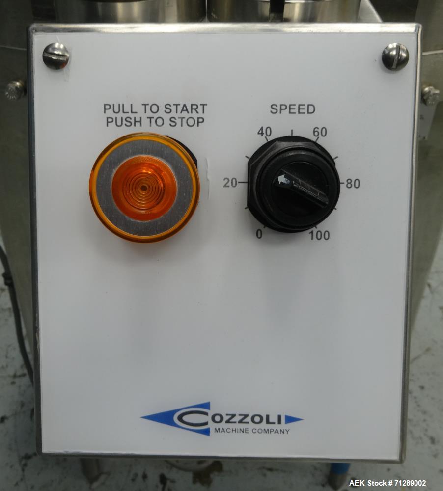 Used Cozzoli Machine Company Rotary Unscrambling/Accumulation Table, Model UT-AT36. 36" Diameter. Has adjustable speed control. Stainless steel construction. Mounted on  (4) legs.