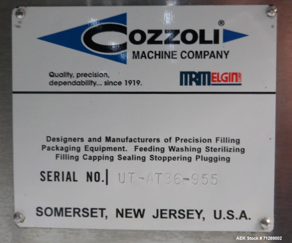 Used Cozzoli Machine Company Rotary Unscrambling/Accumulation Table, Model UT-AT36. 36" Diameter. Has adjustable speed control. Stainless steel construction. Mounted on  (4) legs.