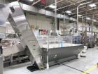 Used Bulk bottle live bottom hopper with integrated stainless steel elevator.