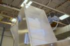 Used Bulk bottle live bottom hopper with integrated stainless steel elevator.