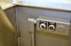 Used Bulk bottle live bottom hopper with integrated stainless steel elevator.