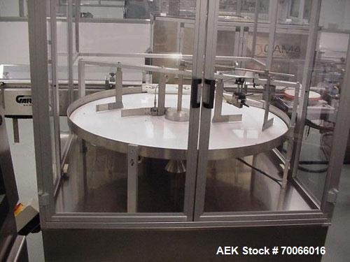 Used Cam-Pak Rotary Feeding/Unscrambling/Accumulation Table, Model TR-1200, 304 Stainless Steel. 1200mm (47.2’’) diameter plastic table, capacity of 400 bottles per minute, container size range Diame...