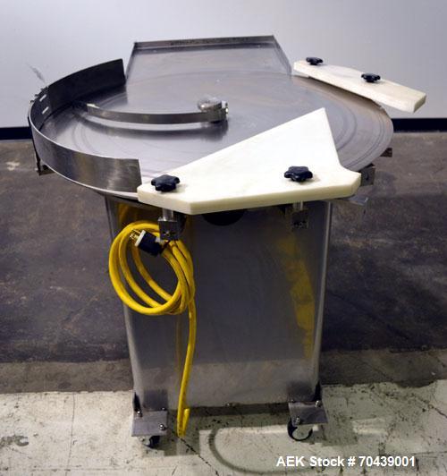 Used Cozzoli Unscrambler/Accumulating Table, Model UT36, Stainless Steel. 36’’ Diameter table with rectangular dump section. Driven by a 1/4hp, 90 volt DC motor with a speed controller. Mounted on ca...