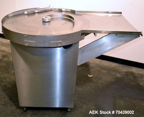 Used Cozzoli Unscrambler/Accumulating Table, Model UT30, Stainless Steel. 30’’ Diameter table with rectangular dump section. Driven by a 1/4 hp, 90 volt DC motor with a speed controller.
