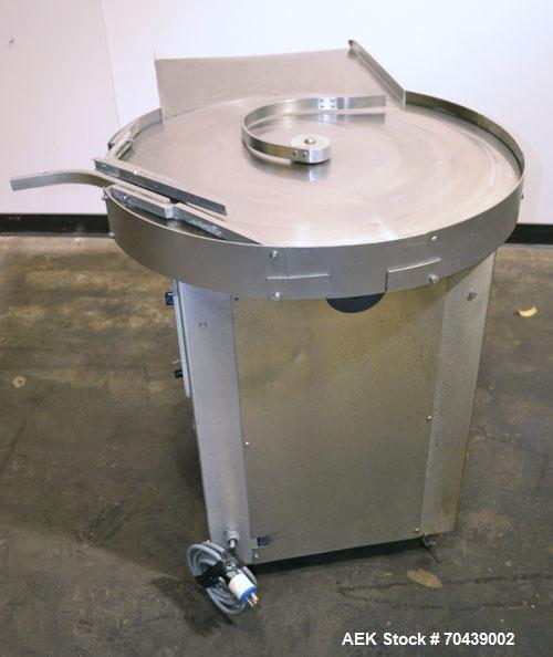 Used Cozzoli Unscrambler/Accumulating Table, Model UT30, Stainless Steel. 30’’ Diameter table with rectangular dump section. Driven by a 1/4 hp, 90 volt DC motor with a speed controller.