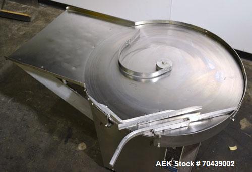 Used Cozzoli Unscrambler/Accumulating Table, Model UT30, Stainless Steel. 30’’ Diameter table with rectangular dump section. Driven by a 1/4 hp, 90 volt DC motor with a speed controller.