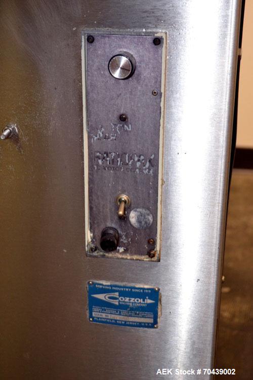 Used Cozzoli Unscrambler/Accumulating Table, Model UT30, Stainless Steel. 30’’ Diameter table with rectangular dump section. Driven by a 1/4 hp, 90 volt DC motor with a speed controller.