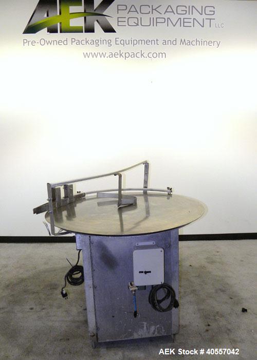 Used Equipment Exporters Accumulation Table, 45" diameter, 304 stainless steel. Driven by a 1/15 hp, 90 volt DC gear motor. Mounted on an aluminum frame. Includes a Dayton speed controller.