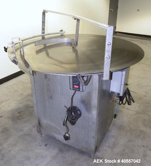 Used Equipment Exporters Accumulation Table, 45" diameter, 304 stainless steel. Driven by a 1/15 hp, 90 volt DC gear motor. Mounted on an aluminum frame. Includes a Dayton speed controller.