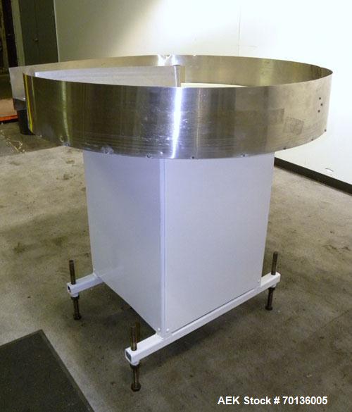 Used Accumulation Table. 48" Diameter plastic table, 5-1/2" tall stainless steel sides, aluminum divider. Driven by a 1/4hp, 1/60/115/208-230 volt, 1725 rpm gear motor. Mounted on a carbon steel base...