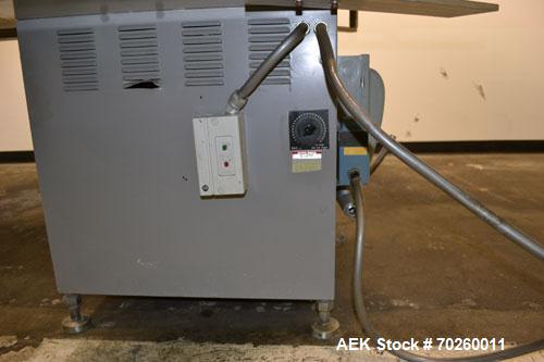 Used Unscramble Accumulating Table, 304 Stainless Steel. 48" Diameter table, 2’’ tall side rails, 14" wide x 24" long in-feed section, 3’’ wide x 36’’ long table top chain conveyor discharge. Driven ...
