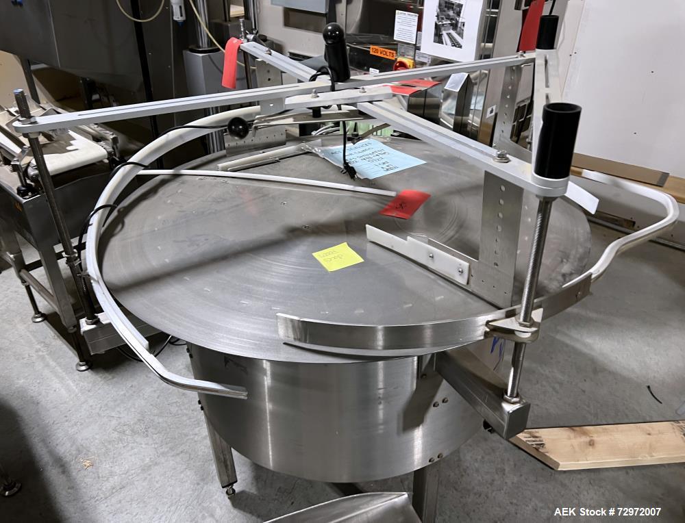 Used- PackWest 48" Diameter Stainless Steel Unscrambling Table, Model #48 UNSCRAMBLER. Includes guide rails that are secured...