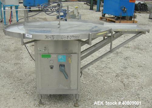 Used Perry Industries Unscrambler, Model VA-48, 304 stainless steel.  48" diameter table, 17 1/2" x 15 1/2" out.  Driven by an approximate 3 hp gearmotor, ratio 300:1.  Mounted on stainless steel leg...