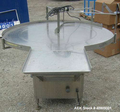 Used Perry Industries Unscrambler, Model VA-48, 304 stainless steel.  48" diameter table, 17 1/2" x 15 1/2" out.  Driven by an approximate 3 hp gearmotor, ratio 300:1.  Mounted on stainless steel leg...