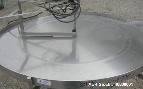Used Perry Industries Unscrambler, Model VA-48, 304 stainless steel.  48" diameter table, 17 1/2" x 15 1/2" out.  Driven by an approximate 3 hp gearmotor, ratio 300:1.  Mounted on stainless steel leg...