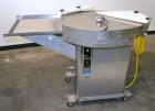 Used Cozzoli Unscrambler/Accumulating Table, Model UT36, Stainless Steel. 36’’ Diameter table with rectangular dump section. Driven by a 1/4hp, 90 volt DC motor with a speed controller. Mounted on ca...