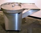 Used Cozzoli Unscrambler/Accumulating Table, Model UT30, Stainless Steel. 30’’ Diameter table with rectangular dump section. Driven by a 1/4 hp, 90 volt DC motor with a speed controller.
