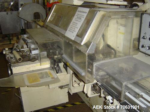 Used Sapal SC3-100 Foil and Bank Wrapper.  300 Wraps/min maximum depending on size and type of bar.  Current set up 125 grams chocolate bars.  6.4" x 3.3" x 0.4" (163 x 85 x 10 mm).  Including PEC an...