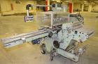 Used BFB (IMA) Model 3701U Automatic Carton Overwrapper. Capable of speeds up to 150' per minute - actual package per minute dependant on materials and application. Package size range: (length) 40mm ...