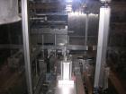 Used Pester Overwrapper, type PEWO-FOLD 1. 450mm max film width, 60mm x 60mm x 20mm min format, 400mm x 350mm x 140mm max format, rated up to 60 cycles/minute, 480 volt, serial #4452, new 1999.