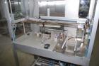 Used Pester Overwrapper wth heat tunnel, model Pewo-Pack-450. Output capacity is approximately 12 packs/minute. PE film width 17.7