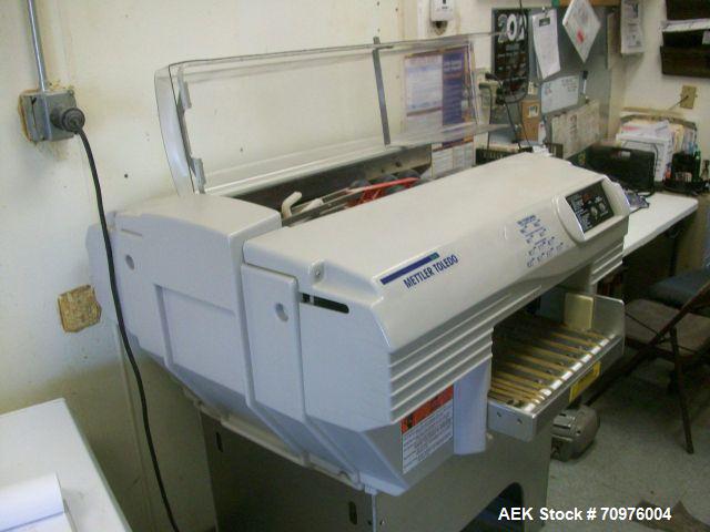 Used Mettler Toledo Wrapper, Model 645 XL-45, 90 degree conveyor, 3' accumulator table.