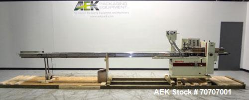 Used Ameripak Model 140S Horizontal Wrapper capable of speeds up to 100 feet per minute. Printed Film Registered Wrapper is convertible with modular fin seal assemblies for either shrink or supported...