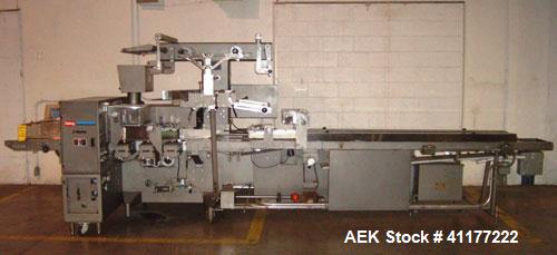 Used Doboy Horizontal Wrapper, Model J. Capable of speeds over 200 packages per minute. Has extended height seal, side belt product infeed belts, film registration, 1 up sealing head 8" wide and has ...