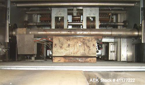 Used Doboy Horizontal Wrapper, Model J. Capable of speeds over 200 packages per minute. Has extended height seal, side belt product infeed belts, film registration, 1 up sealing head 8" wide and has ...