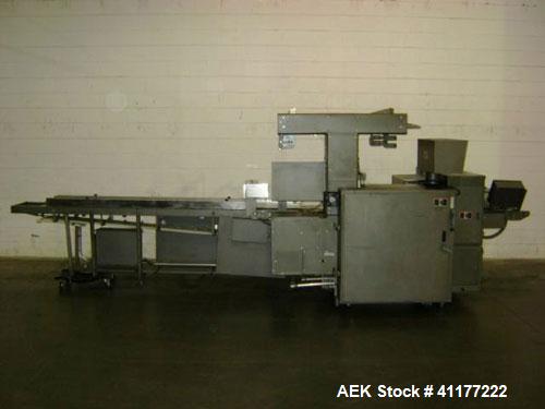 Used Doboy Horizontal Wrapper, Model J. Capable of speeds over 200 packages per minute. Has extended height seal, side belt product infeed belts, film registration, 1 up sealing head 8" wide and has ...