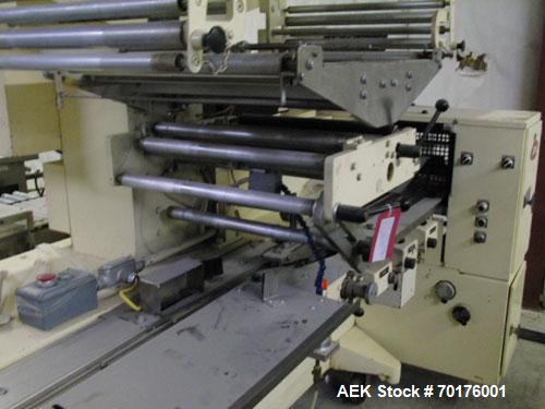 Used Doboy Model J Horizontal Wrapper capable of speeds over 200 packages per minute. Film registration, 1 up sealing head 12" with seal jaws, 10' long lugged chain infeed on 11-1/2" centers. Has pri...