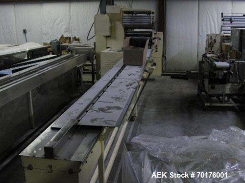 Used Doboy Model J Horizontal Wrapper capable of speeds over 200 packages per minute. Film registration, 1 up sealing head 12" with seal jaws, 10' long lugged chain infeed on 11-1/2" centers. Has pri...