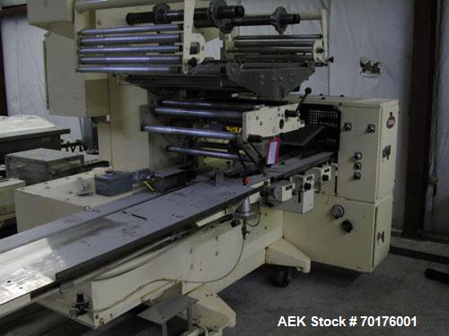 Used Doboy Model J Horizontal Wrapper capable of speeds over 200 packages per minute. Film registration, 1 up sealing head 12" with seal jaws, 10' long lugged chain infeed on 11-1/2" centers. Has pri...