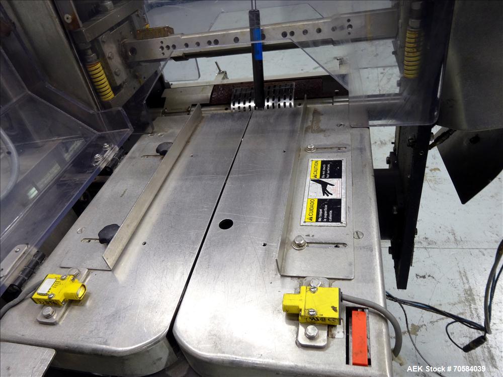 Used Bosch (Doboy) Linium 311 horizontal wrapper. Parts Machine Only.  1 up crimper capable of speeds up to 150 packages per minute (can run up to 350 packages per minute on a 2 up configuration). Ha...