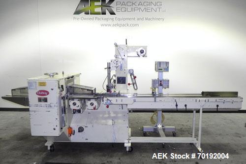 Used Doboy Mustang IV Horizontal Wrapper. Machine is capable of speeds up to 150 cpm. 1 up unit with film registration andArgus bar code scanner. Package size range: length up to 15", height up to 2-...