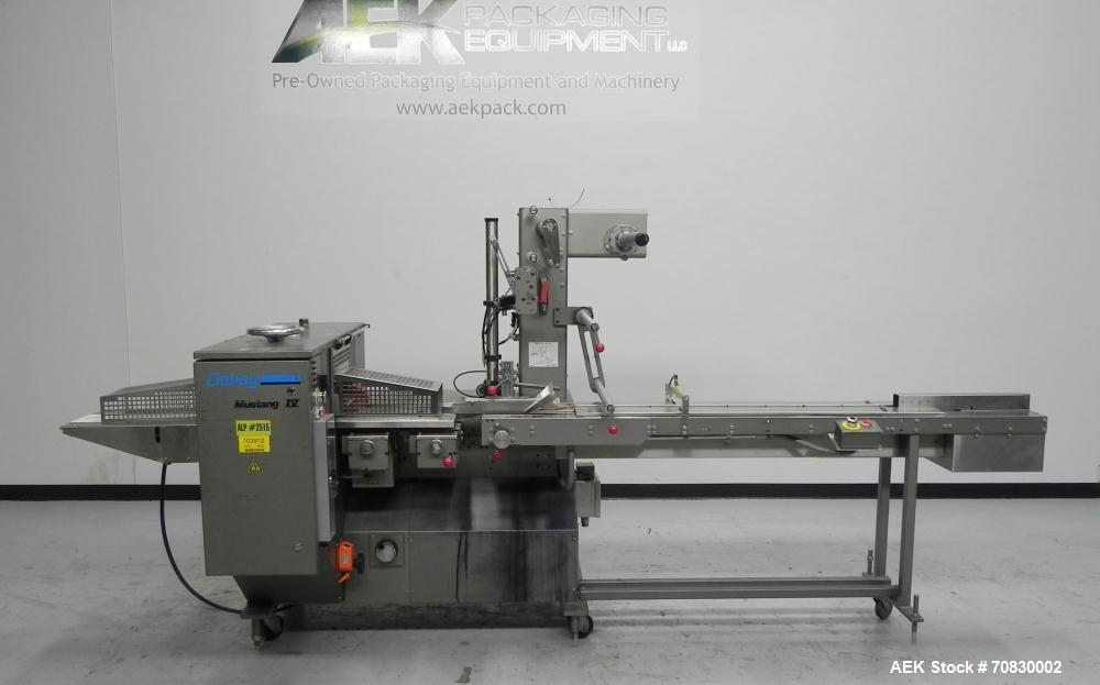 Used Doboy Mustang IV Horizontal Wrapper. Machine is capable of speeds up to 150 cpm. 2 up unit with film registration. Package size range: length up to 15", height up to 2-1/4", width up to 6-1/2". ...