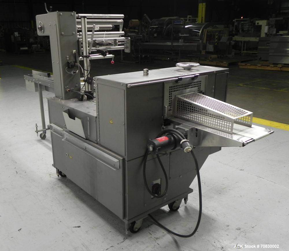 Used Doboy Mustang IV Horizontal Wrapper. Machine is capable of speeds up to 150 cpm. 2 up unit with film registration. Package size range: length up to 15", height up to 2-1/4", width up to 6-1/2". ...