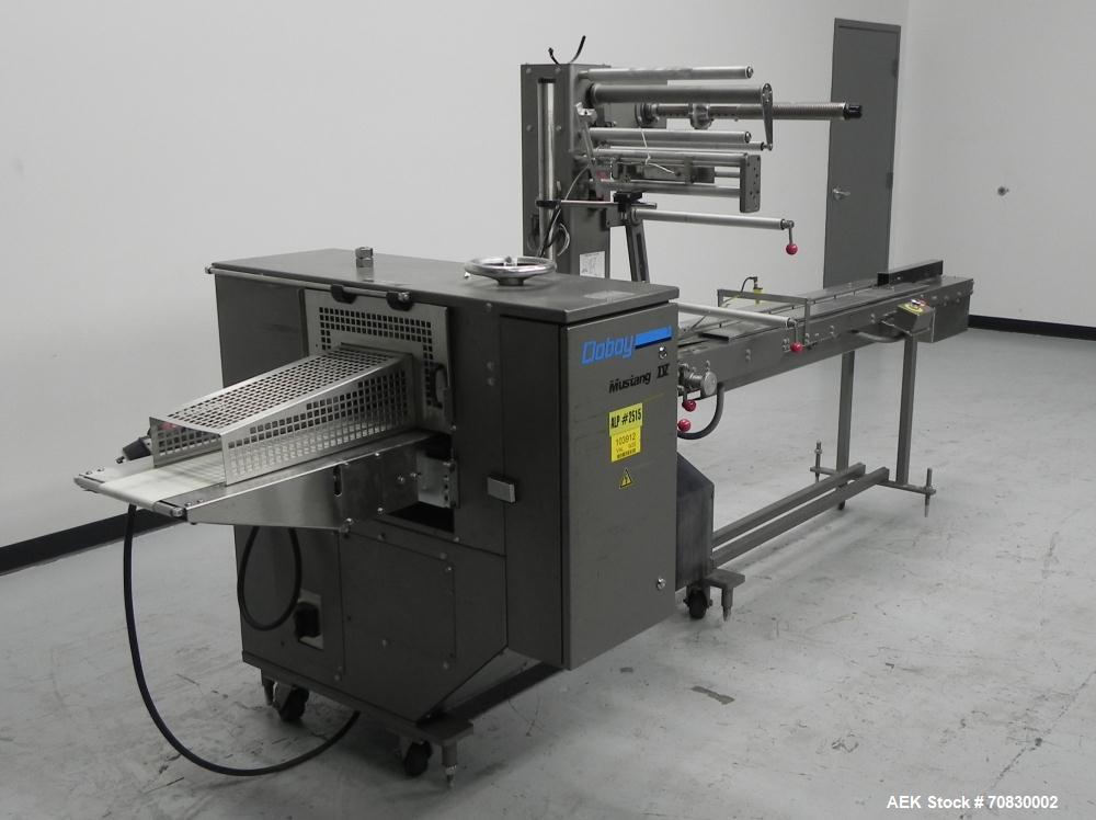 Used Doboy Mustang IV Horizontal Wrapper. Machine is capable of speeds up to 150 cpm. 2 up unit with film registration. Package size range: length up to 15", height up to 2-1/4", width up to 6-1/2". ...