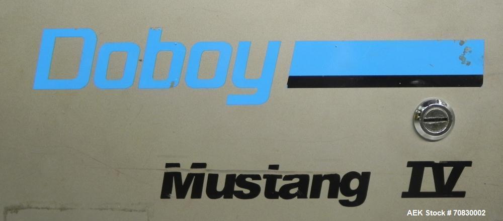 Used Doboy Mustang IV Horizontal Wrapper. Machine is capable of speeds up to 150 cpm. 2 up unit with film registration. Package size range: length up to 15", height up to 2-1/4", width up to 6-1/2". ...