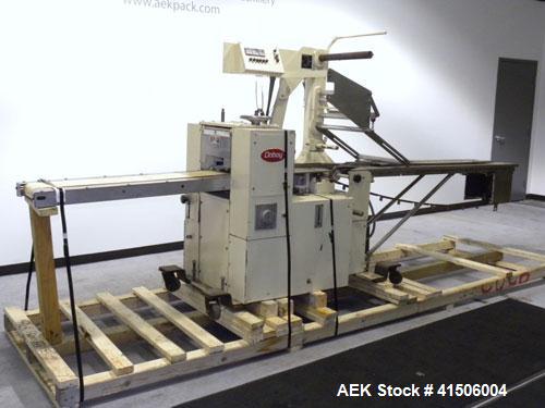 Used Doboy Mustang Horizontal Wrapper. Capable of speeds up to 90 packages per minute. Has a package size range of 1/2" to 7" width x 3" to 15" length, and a maximum height up to 2-3/4". Has an 8" wi...